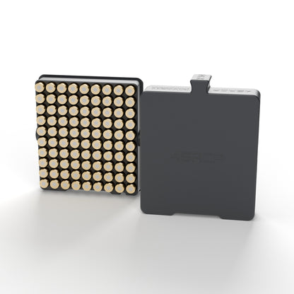 .45 ACP luggage case in graphite holding 90 rounds primer-up, next to its slide-off lid