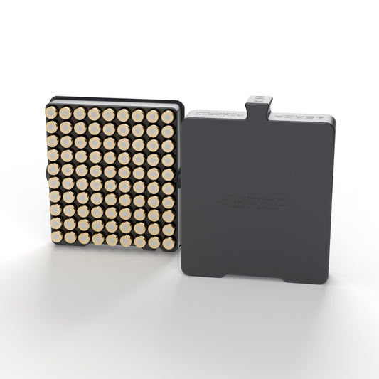 .45 ACP luggage case in graphite holding 90 rounds primer-up, next to its slide-off lid